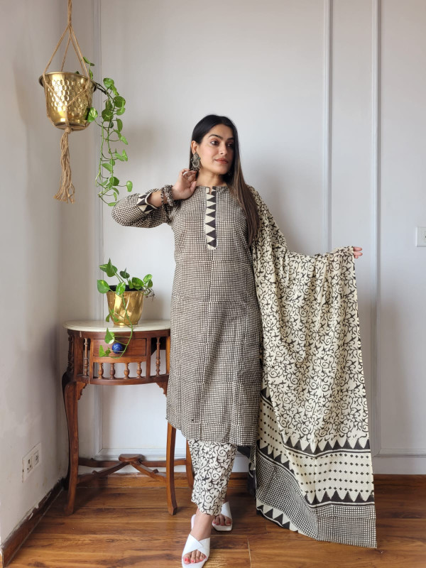 black and white geometric hand block printed cotton kurta, pants, and dupatta suit set.